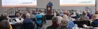 Tom Meuser speaks to an audience at a 遗留的学者 Breakfast for the Center of Excellence in Aging and 健康